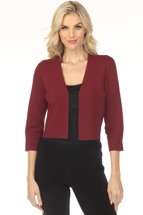 Woman wearing a red bolero with open front and pearl accent at the sleeves from Joseph Ribkoff