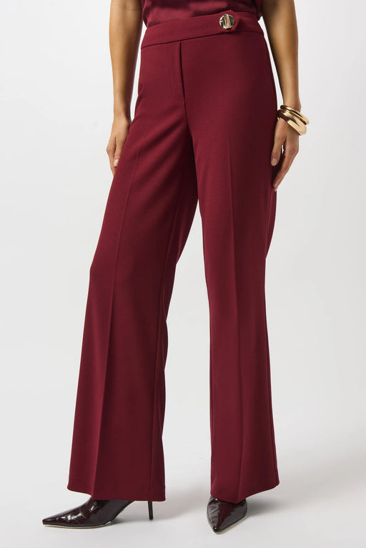 Woman wearing a solid color red wide leg trouser pant