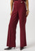 Woman wearing a solid color red wide leg trouser pant