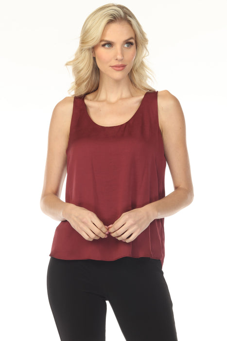 Woman wearing a red sleeveless top with scoop neckline from Joseph Ribkoff