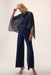 Woman wearing a dark blue jumpsuit with chiffon overlay and wide leg from Joseph Ribkoff