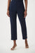 Woman wearing a dark blue cropped high waist pants with gold rose buttons at the hem from Joseph Ribkoff