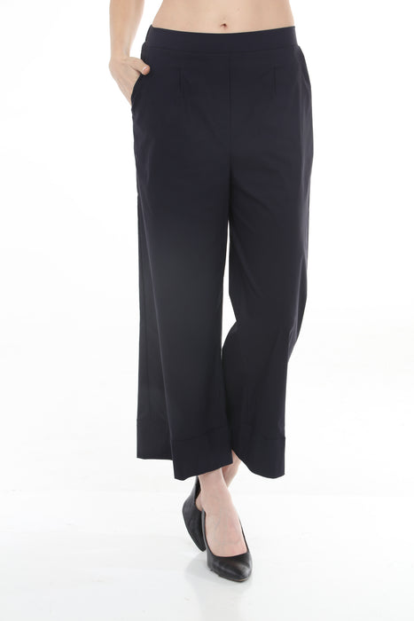 Woman wearing Joseph Ribkoff pleated wide-leg trousers for elegant office outfit