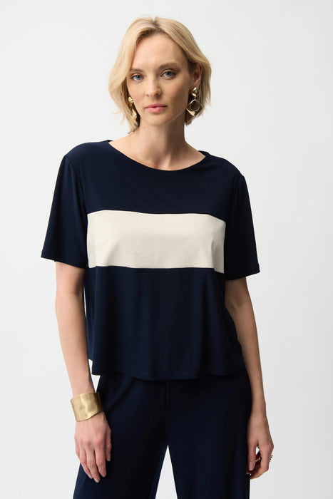 Woman wearing Joseph Ribkoff midnight blue color block boxy top styled for casual chic outings, office casual wear, travel days, and modern everyday fashion.