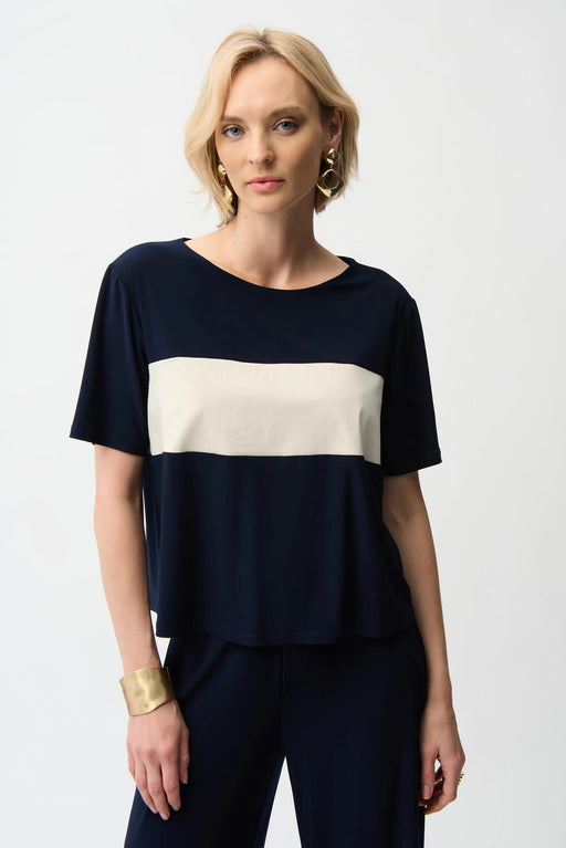 Woman wearing Joseph Ribkoff midnight blue color block boxy top styled for casual chic outings, office casual wear, travel days, and modern everyday fashion.
