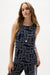 Woman wearing Joseph Ribkoff geometric print straight blouse, featuring a bold patterned design, relaxed silhouette, lightweight fabric, and a polished modern fit.