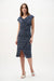 Woman wearing Joseph Ribkoff midnight blue multi geometric print sheath wrap dress with draped neckline, knee-length cut, and a flattering fitted silhouette.
