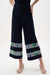 Woman wearing Joseph Ribkoff midnight blue multi stripe culotte pants