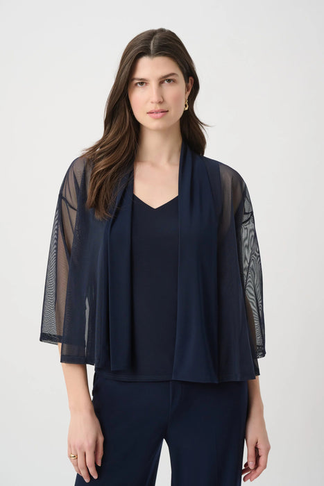Woman wearing a blue sheer jacket with open front and 3/4 sleeves from Joseph Ribkoff