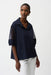 Woman wearing Joseph Ribkoff midnight blue poplin and mesh boxy blouse styled for office wear, smart casual outings, travel, and modern chic looks.