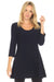 Woman wearing a dark blue tunic top with scoop neck and flared hem from Joseph RIbkoff