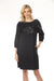 Woman wearing a dark blue sequined shift dress with side pockets and above the knee length from Joseph Ribkoff
