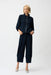 Woman wearing a navy blue textured pull on cropped pants with wide leg from Joseph Ribkoff
