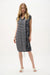 Woman wearing a conversational print cocoon dress with striped pattern and relaxed silhouette for a chic casual look