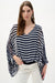 Woman wearing Joseph Ribkoff midnight blue and vanilla stripe print poncho top styled for resort wear, vacation outfits, summer outings, and casual chic looks.