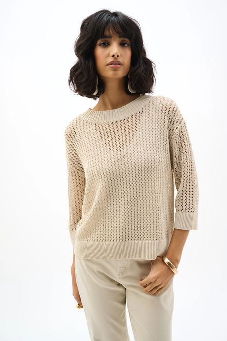 Woman wearing Joseph Ribkoff acrylic blend open stitch sweater styled for summer evenings, resort wear, and lightweight layered outfits.