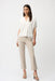 Woman wearing beige straight leg ankle-length jeans from Joseph Ribkoff