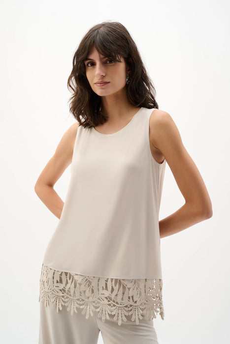Woman wearing Joseph Ribkoff moonstone guipure lace hem sleeveless top styled for office wear, evening events, special occasions, and elegant day looks.