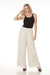 Woman styling Joseph Ribkoff polka dot wide-leg trousers for office wear