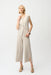 Woman wearing a beige cropped wide leg pants with side slit hem from Joseph Ribkoff
