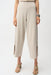 Woman wearing a beige cropped wide leg pants with side slit hem from Joseph Ribkoff