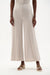 Woman wearing Joseph Ribkoff Moonstone wide leg pants with pintuck detail