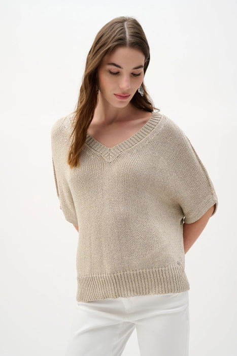 Woman wearing a beige v-neck sweater top with short dolman sleeves from Joseph Ribkoff
