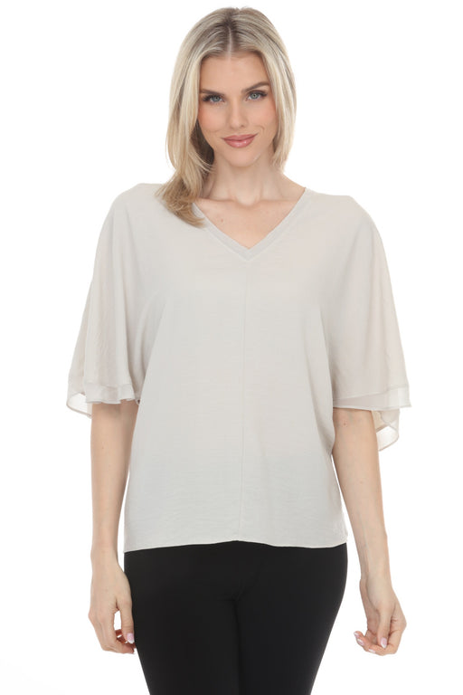 Woman wearing a gray lightweight top with v-neck and short flutter sleeves from Joseph Ribkoff