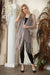Woman wearing Joseph Ribkoff fringe kimono cover-up for resort vacation outfit
