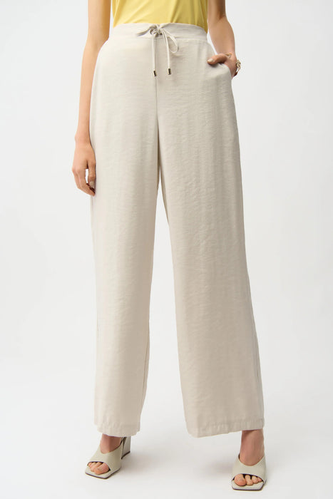 Woman wearing Joseph Ribkoff moonstone woven wide leg pull-on pants with drawstring waist