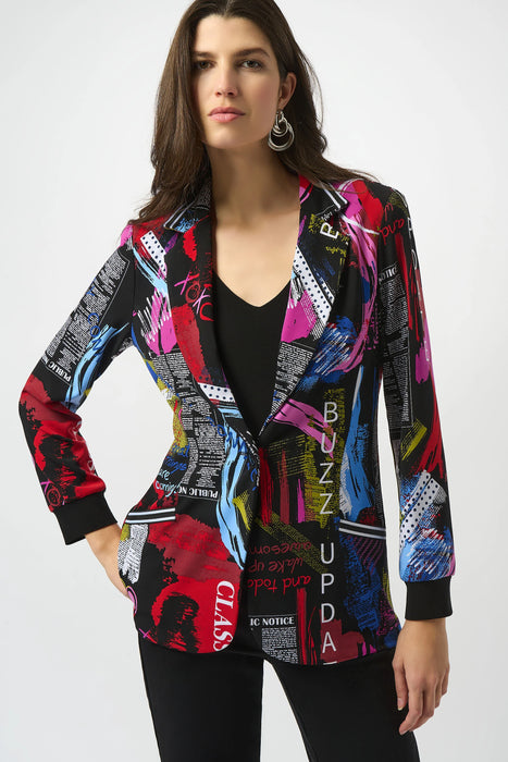 Woman wearing a colorful patterned blazer jacket with newspaper print