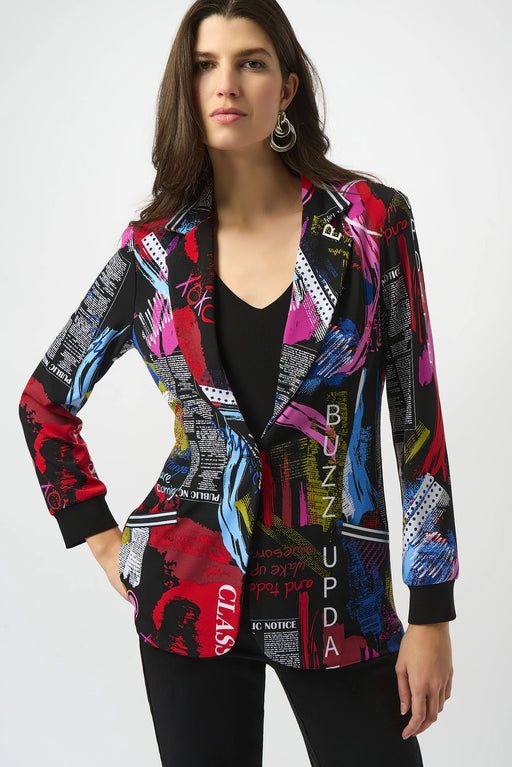 Woman wearing a colorful patterned blazer jacket with newspaper print