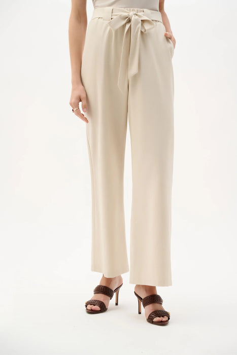 Woman wearing Joseph Ribkoff linen woven wide leg pull-on pants with sash tie styled for summer outfits, resort wear, and casual chic fashion.
