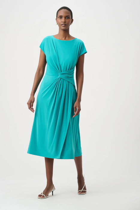 Woman wearing Joseph Ribkoff A-line wrap dress for elegant office outfit