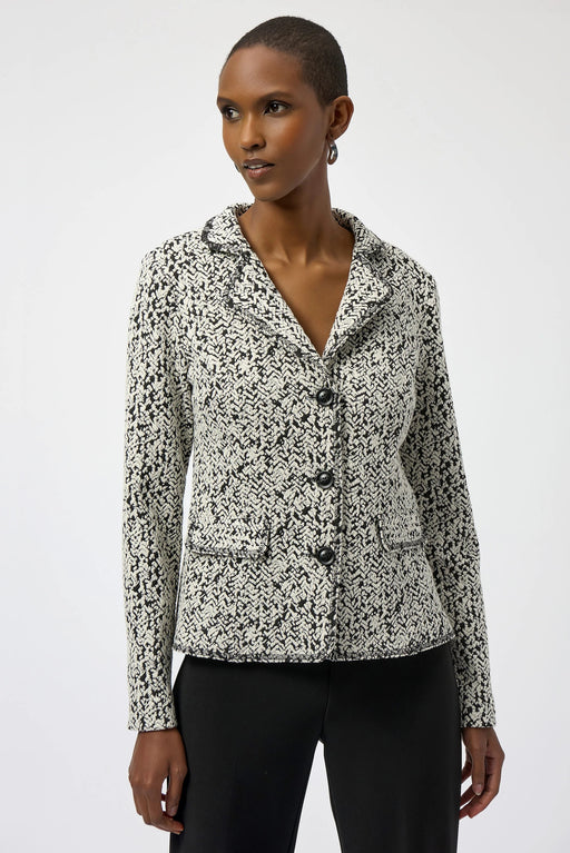Woman wearing an abstract-patterned jacquard knit blazer jacket with button front from Joseph Ribkoff