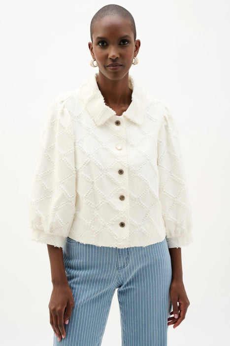 Woman wearing Joseph Ribkoff off-white cotton twill jacket with puff sleeves