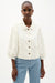Woman wearing Joseph Ribkoff off-white cotton twill jacket with puff sleeves
