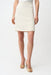 Woman wearing an off-white A-line skirt with gold stripes from Joseph Ribkoff