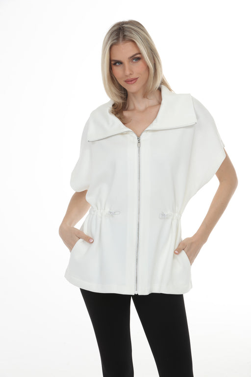 Woman wearing Joseph Ribkoff scuba jersey jacket for chic travel outfit