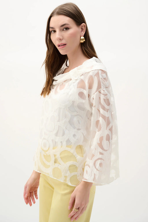 Woman wearing Joseph Ribkoff cowl neck boxy top for elegant office outfit