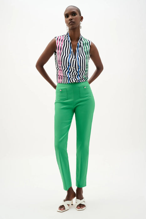 Woman wearing a green slim cropped pants with pull on waistband and patch pockets from Joseph Ribkoff