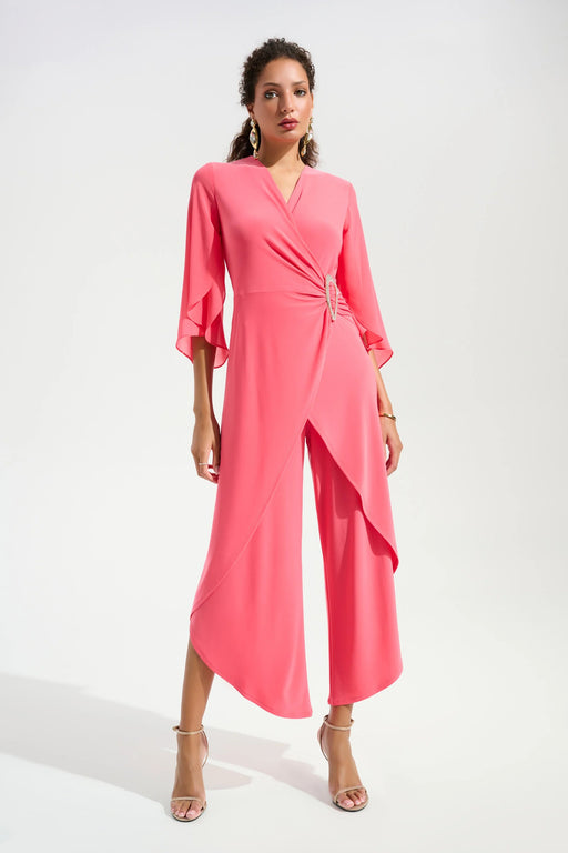 Woman wearing a pink wrap jumpsuit with 3/4 sleeves and cropped tulip wide leg from Joseph Ribkoff