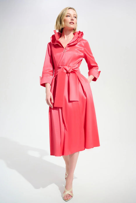 Woman wearing a pink pleated midi flared dress with double collar, belt, and side pockets from Joseph Ribkoff
