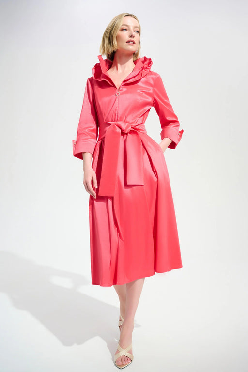 Woman wearing a pink pleated midi flared dress with double collar, belt, and side pockets from Joseph Ribkoff