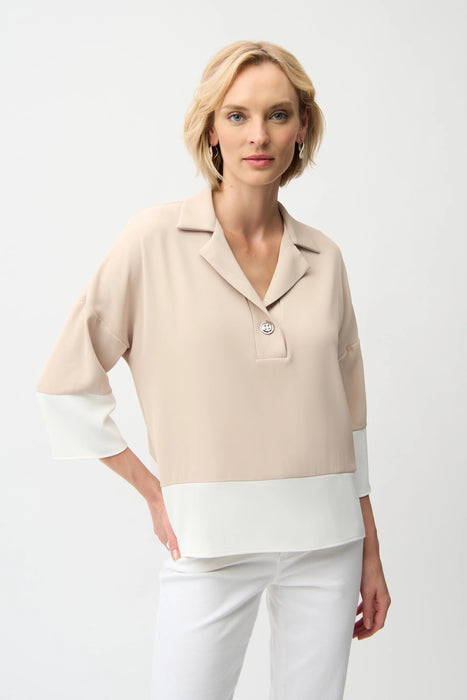 Woman wearing a parchment color block boxy top with shirt collar and dolman sleeves, styled for resort wear, travel, office chic, or casual elegant outfits.