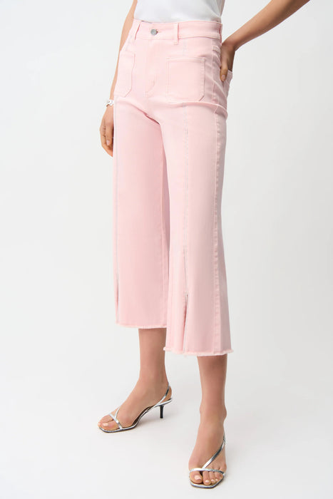 Woman wearing light pink cropped jeans with rhinestone embellishments and frayed hem from Joseph Ribkoff