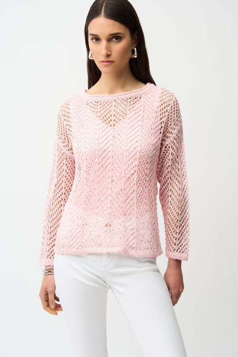 Woman wearing a pink open-knit sweater with sequins and long sleeves from Joseph Ribkoff