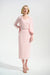 Woman wearing a light pink textured midi pencil skirt with pull on high waist from Joseph Ribkoff