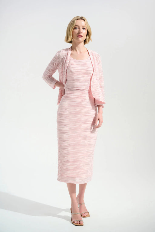 Woman wearing a light pink textured midi pencil skirt with pull on high waist from Joseph Ribkoff