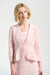 Woman wearing a pink textured peplum 3/4 sleeves jacket with an inner tank from Joseph Ribkoff